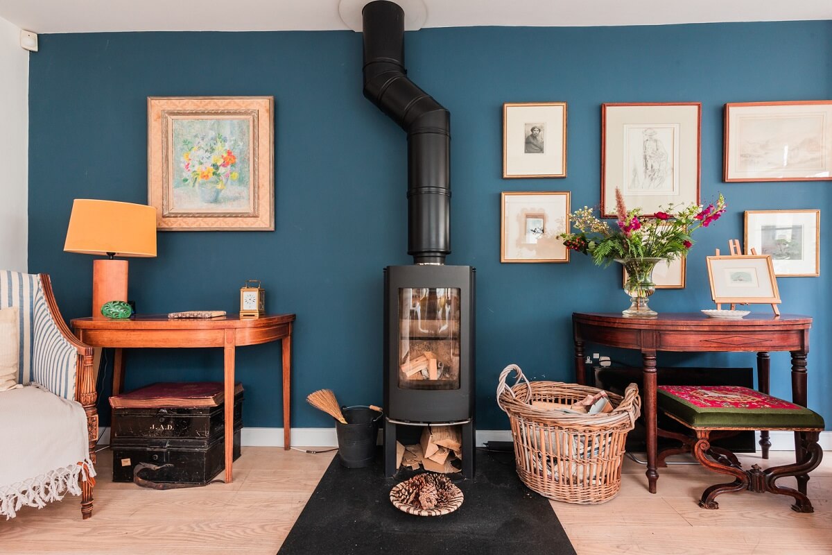 A Home with Cottage Interiors in a Former Cambridge Shop 9 blue accent wall woodburner