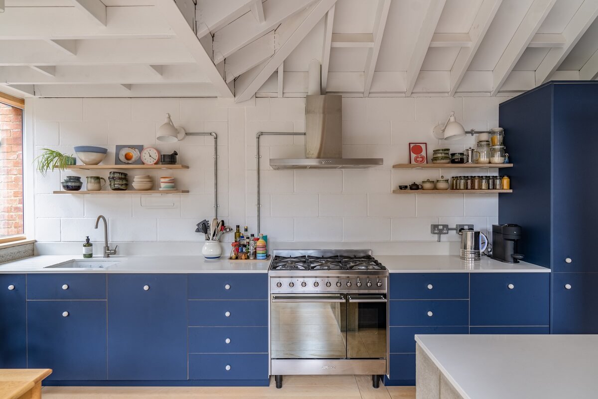An Award-Winning Apartment with a Modern Extension 10 blue kitchen with shelves