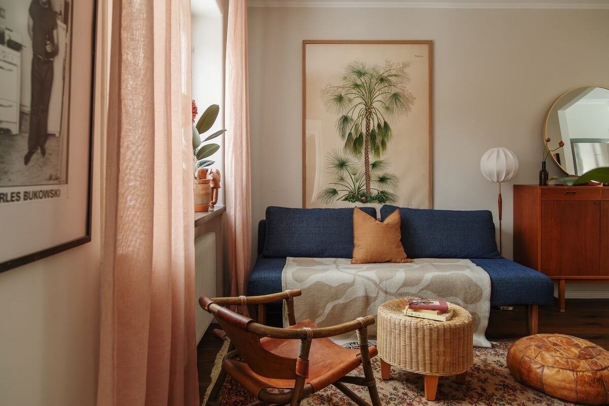 A Small Swedish Apartment with Warm Color Accents 5 blue sofa and warm color in small living room