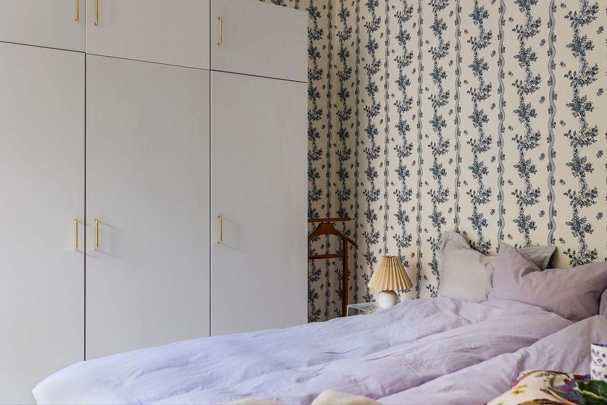 A Small Split-Level Apartment in Stockholm 12 blue wallpaper bedroom