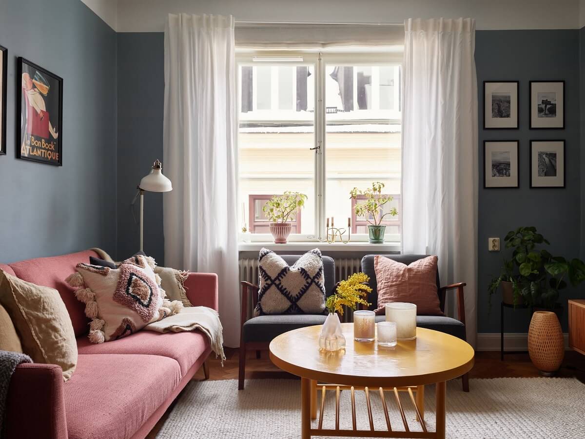 Green Tones in a Renovated Stockholm Duplex Apartment 2 colorful living room with pink sofa