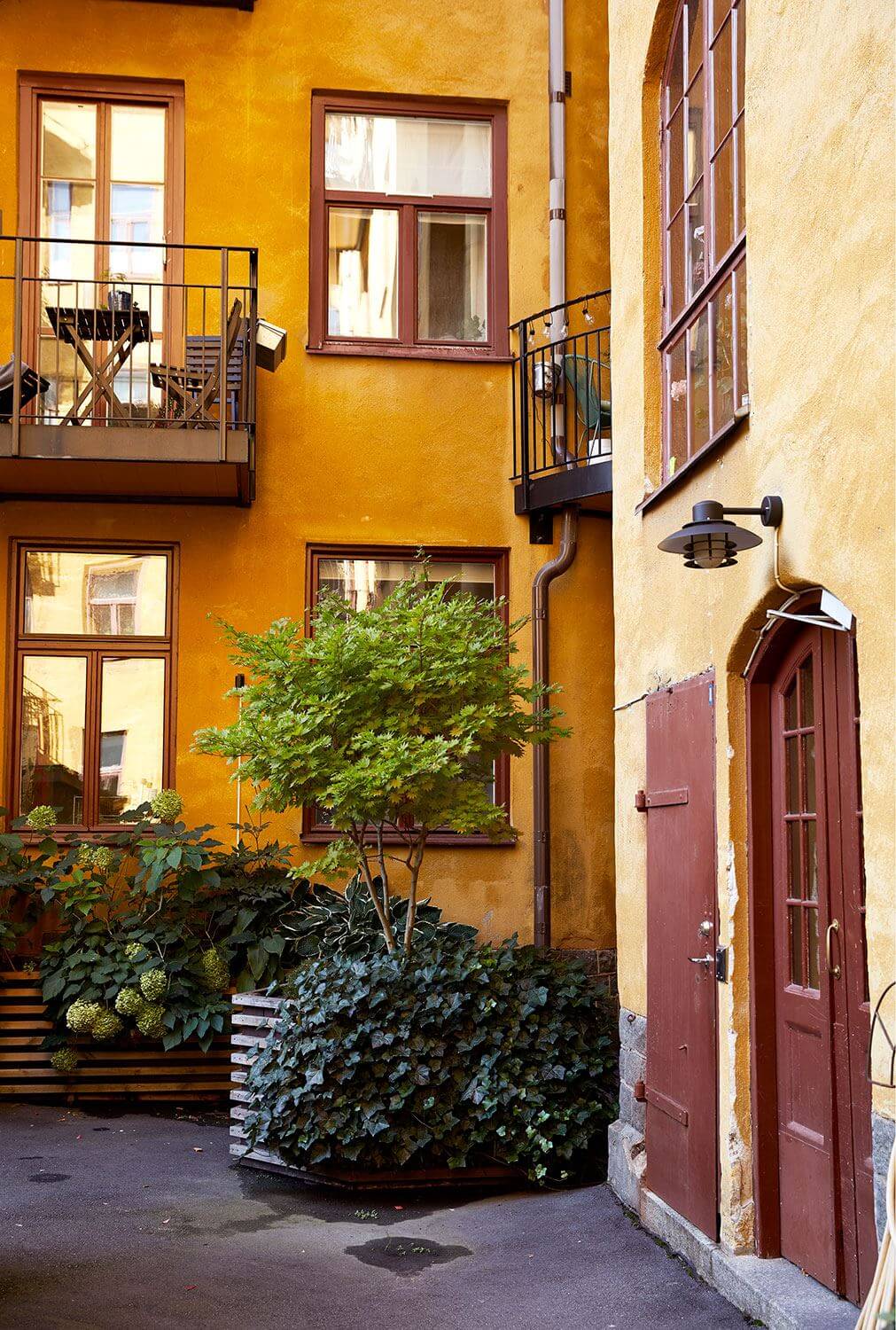 Serene Light Painted Spaces in a Swedish Apartment 23 colorful-swedish-courtyard