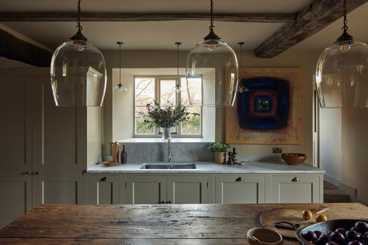 A Historic English Country House with Restored Interiors 4 country kitchen gray cabinets rustic wooden prep table nordroom