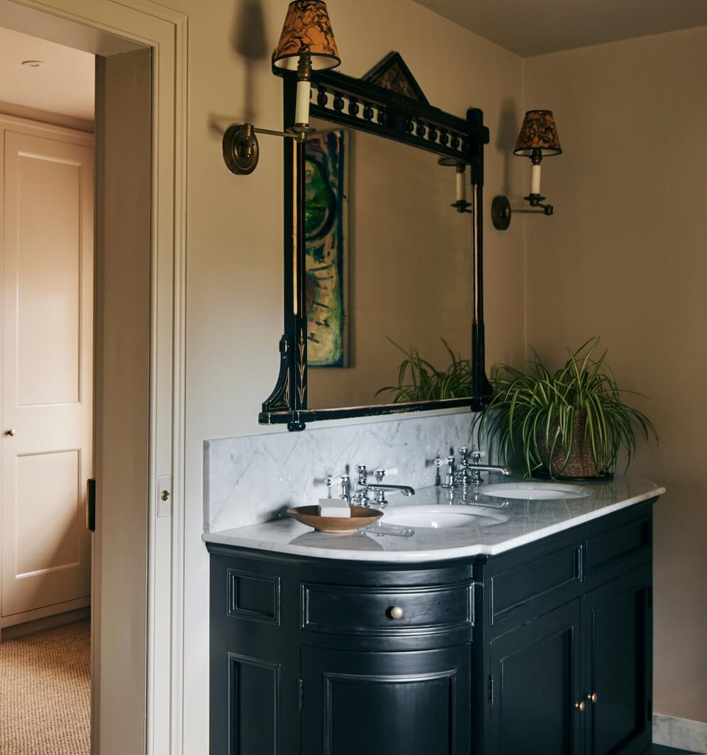 A Historic English Country House with Restored Interiors 23 curved bathroom vanity