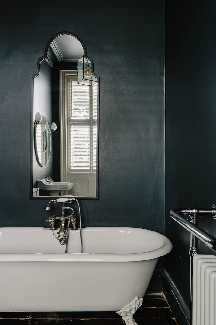 Colorful Walls in an English Victorian Townhouse 20 dark blue victorian bathroom with wooden floor and clawfoot bath nordroom