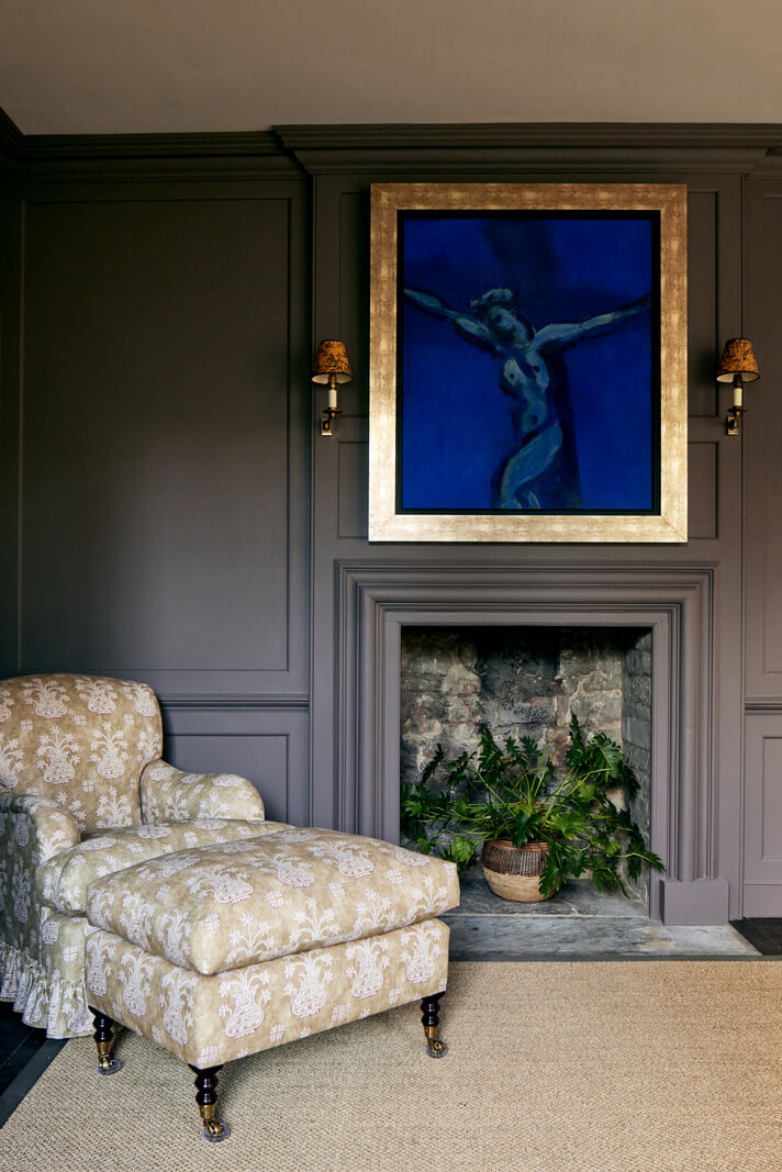 A Historic English Country House with Restored Interiors 21 dark gray bedroom with sitting chair