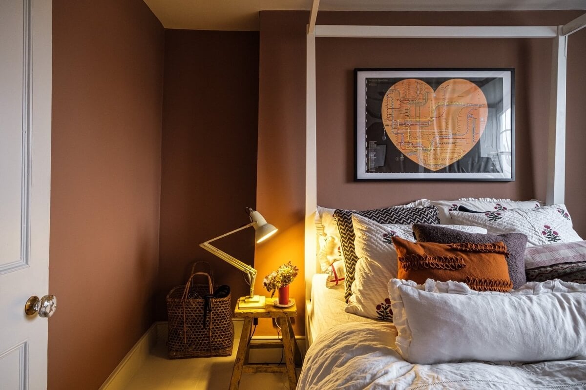 A Cozy and Charming Georgian Townhouse in London 20 dark pink walls bedroom with canopy bed
