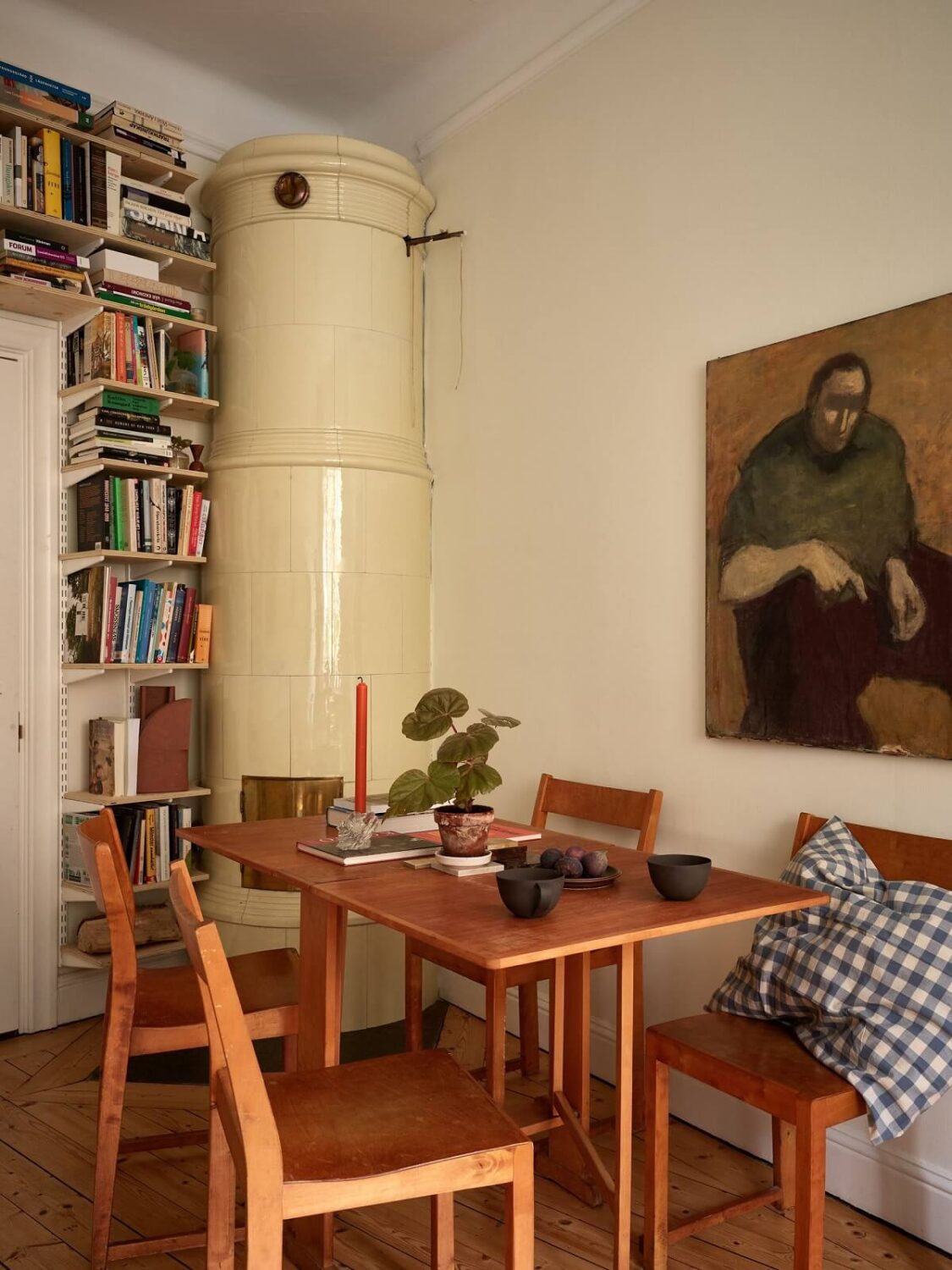 A Cozy Swedish Apartment Filled with Charm 6 dining table with fireplace