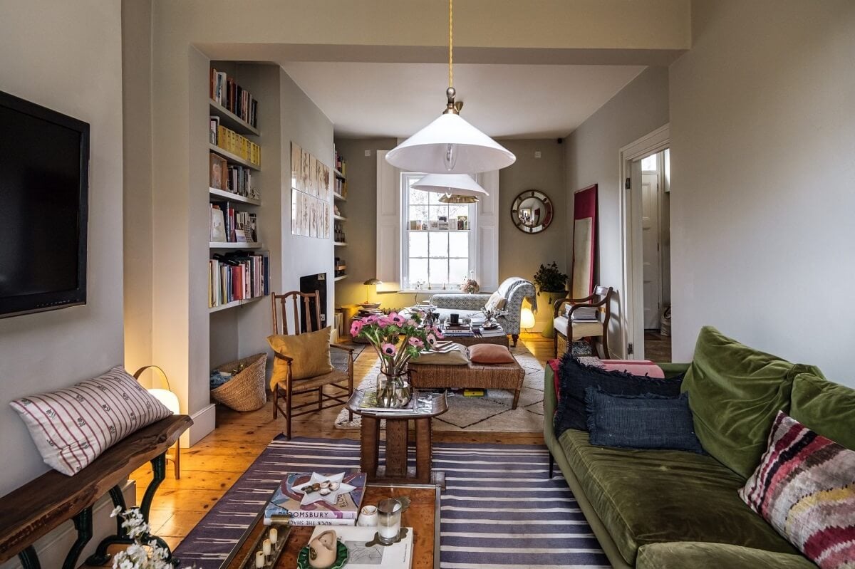 A Cozy and Charming Georgian Townhouse in London 1 double living room with green sofa and striped rug