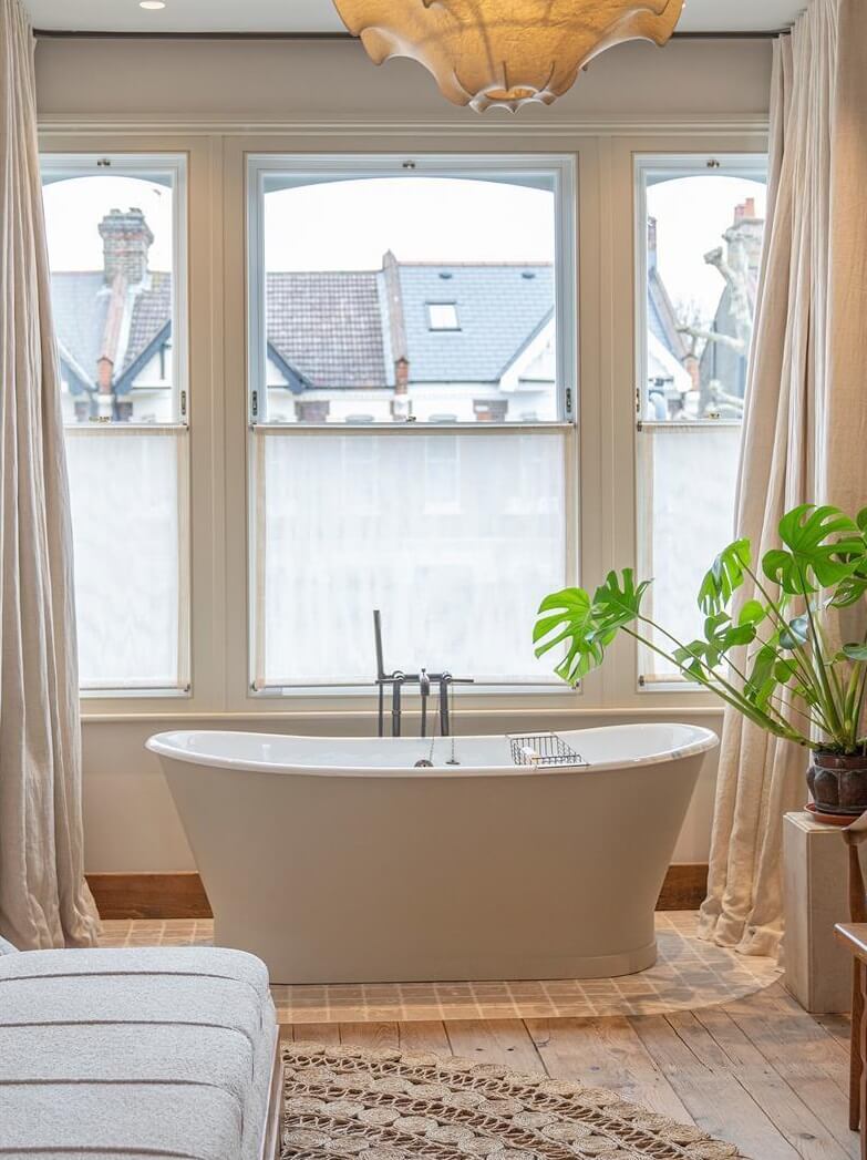 Modern Rustic Interiors in an Edwardian House in London 23 freestanding bath in bedroom
