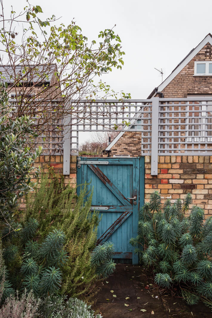 A Home with Cottage Interiors in a Former Cambridge Shop 27 garden blue gate cambridge house
