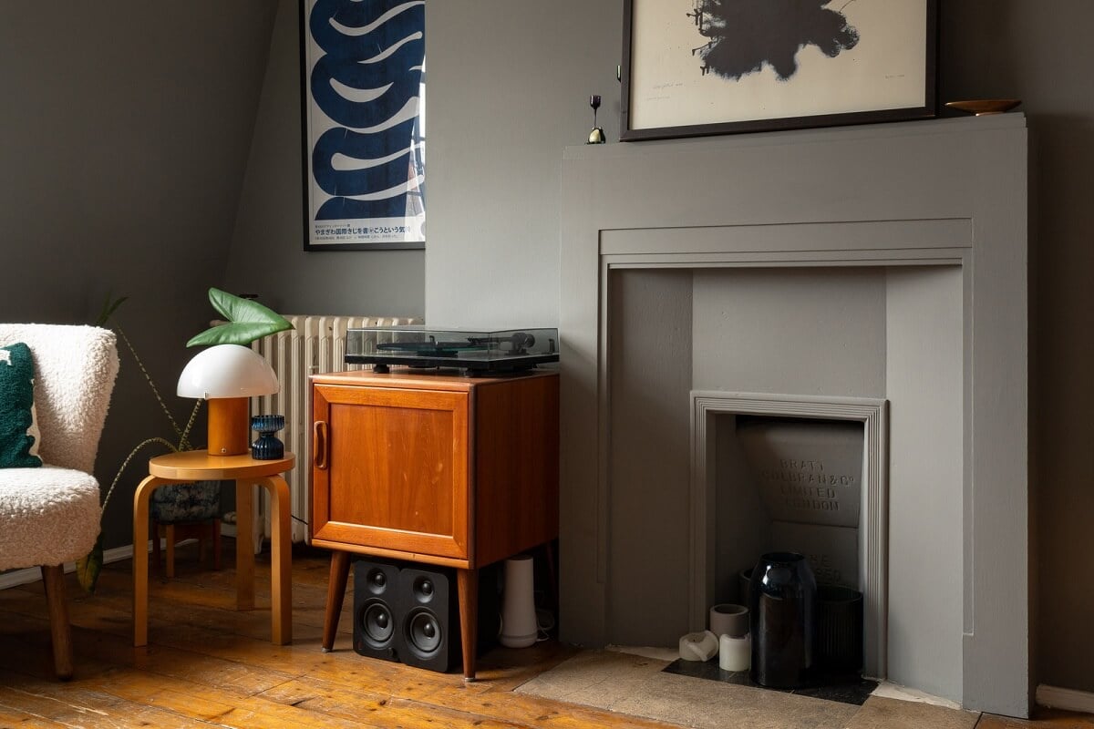 A Charming Top-Floor Apartment in an Art Deco Building 3 gray living room with warm wooden floor