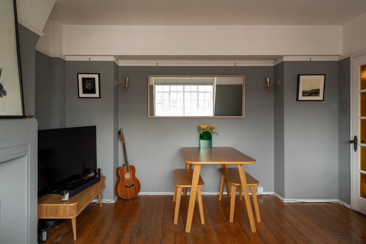 A Charming Top-Floor Apartment in an Art Deco Building 4 gray living room wooden floor