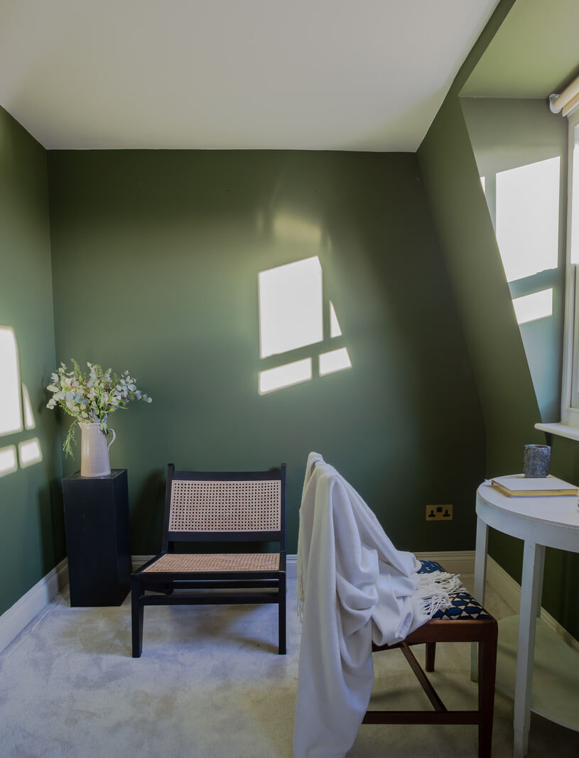 An Exposed Brick Wall in a London Duplex Apartment 18 green attic room dormer window