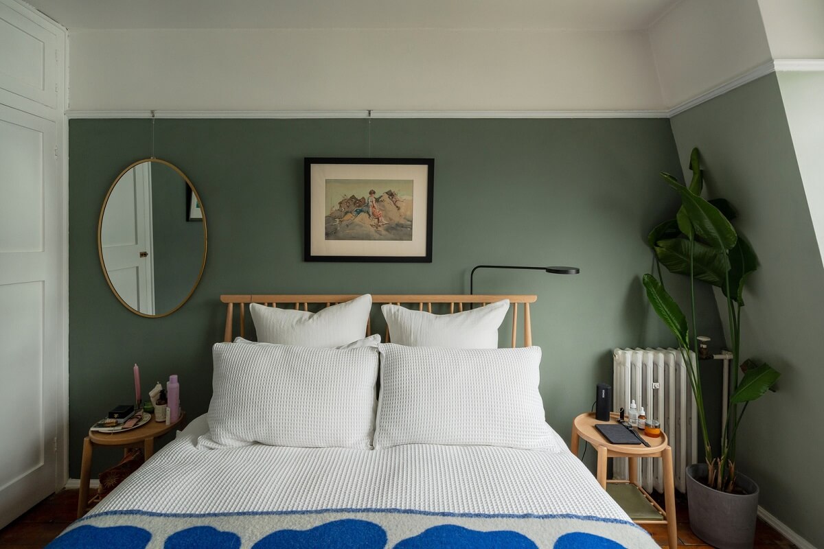 A Charming Top-Floor Apartment in an Art Deco Building 11 green wall paint and oval mirror