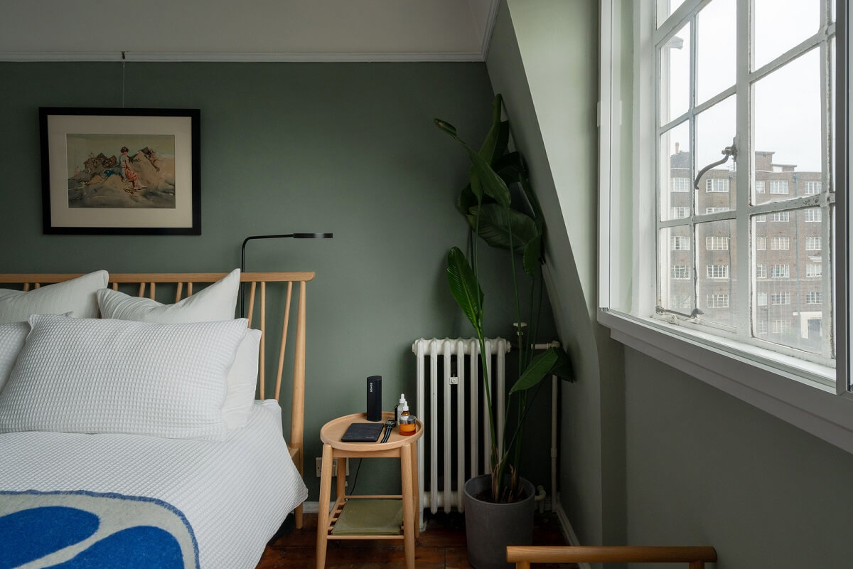 A Charming Top-Floor Apartment in an Art Deco Building 12 green wall paint bedroom