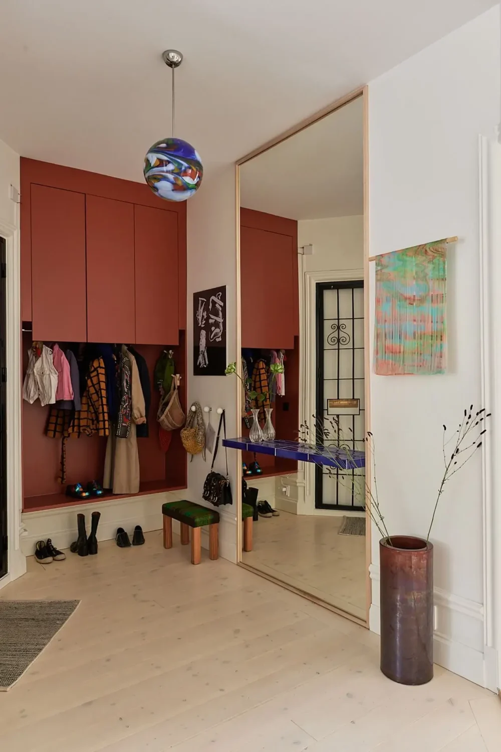 50+ Rooms That Prove ‘The Unexpected Red Theory’ Really Works 18 hallway with red built in cabinets nordroom