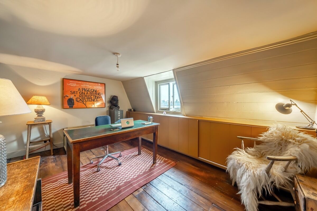 A Colorful Historic Family Home in London 27 home office with slanted ceiling