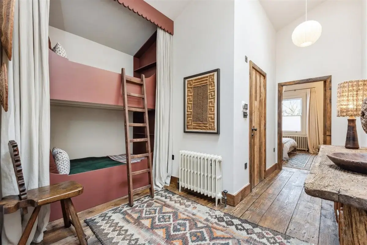Modern Rustic Interiors in an Edwardian House in London 28 kids bedroom with pink built in bunk beds