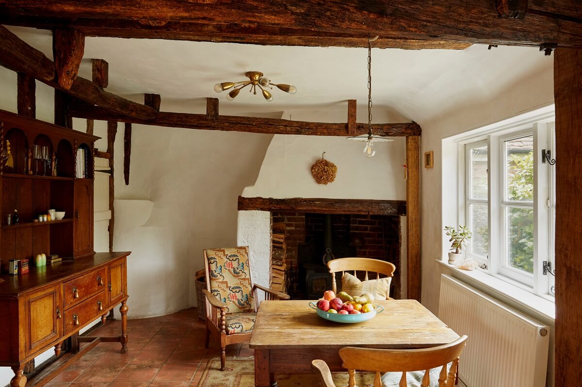 A Cozy Home with Exposed Beams in a Former Post Office 1 kitchen-dining-space-exposed-beams-terracotta-floor-nordroom