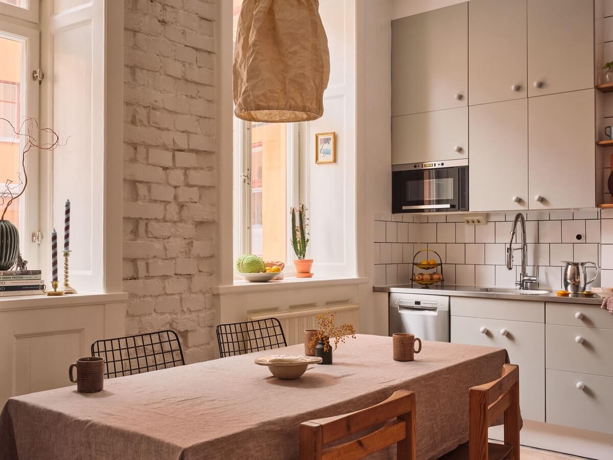 Serene Light Painted Spaces in a Swedish Apartment 10 kitchen-white-painted-brick-wall