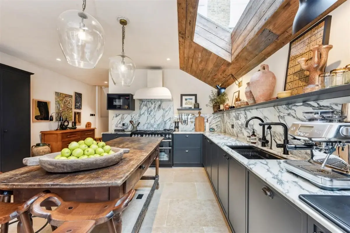 Modern Rustic Interiors in an Edwardian House in London 9 kitchen with rustic wooden island and skylight in wooden ceiling