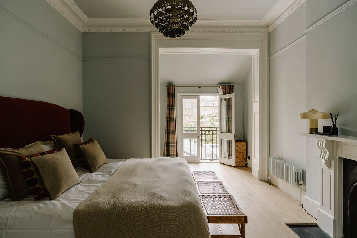 Colorful Walls in an English Victorian Townhouse 12 light blue bedroom with pink headboard