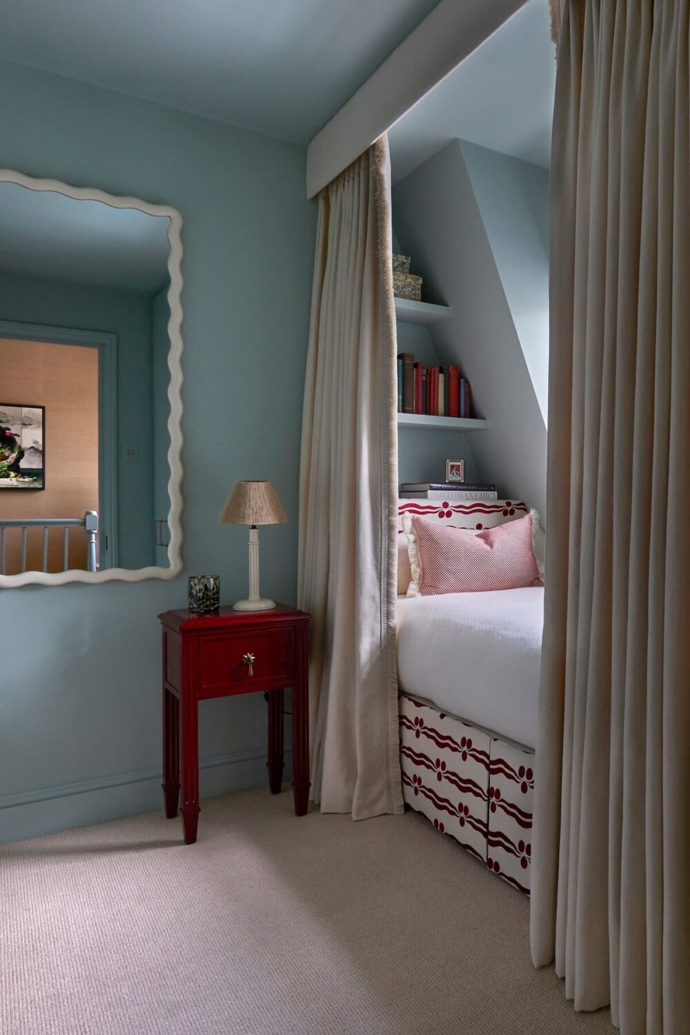 50+ Rooms That Prove ‘The Unexpected Red Theory’ Really Works 12 light blue bedroom with red side table unexpected red theory