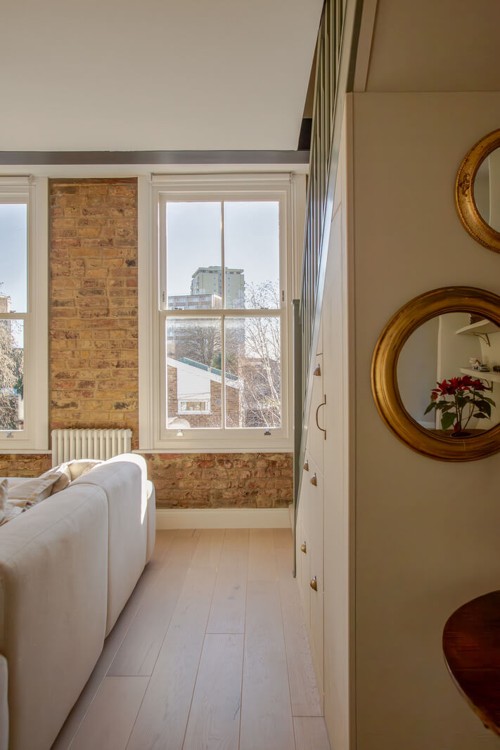An Exposed Brick Wall in a London Duplex Apartment 7 living room detail