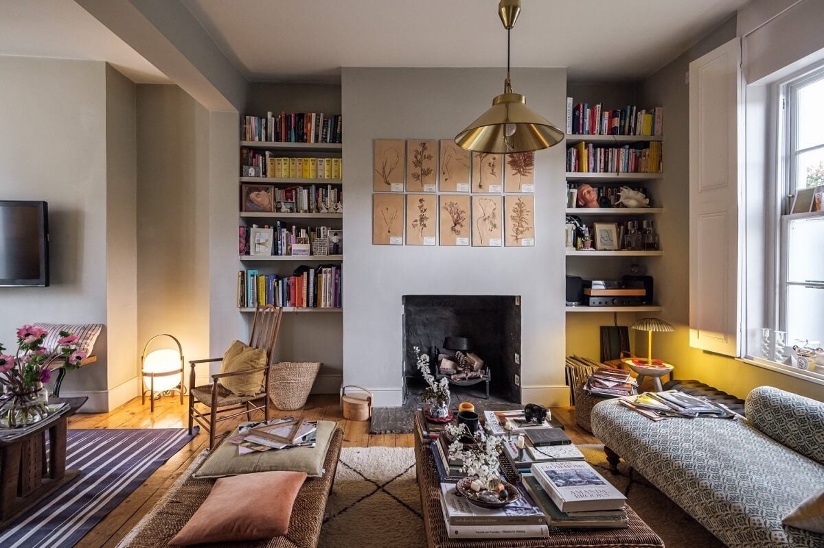 A Cozy and Charming Georgian Townhouse in London 3 living room with fireplace and bookshelves