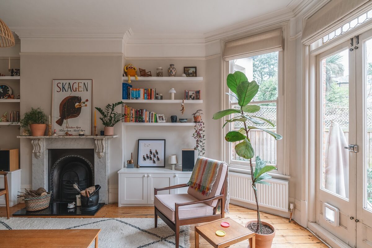 An Award-Winning Apartment with a Modern Extension 1 living room with light gray windows bay window fireplace and bookshelves