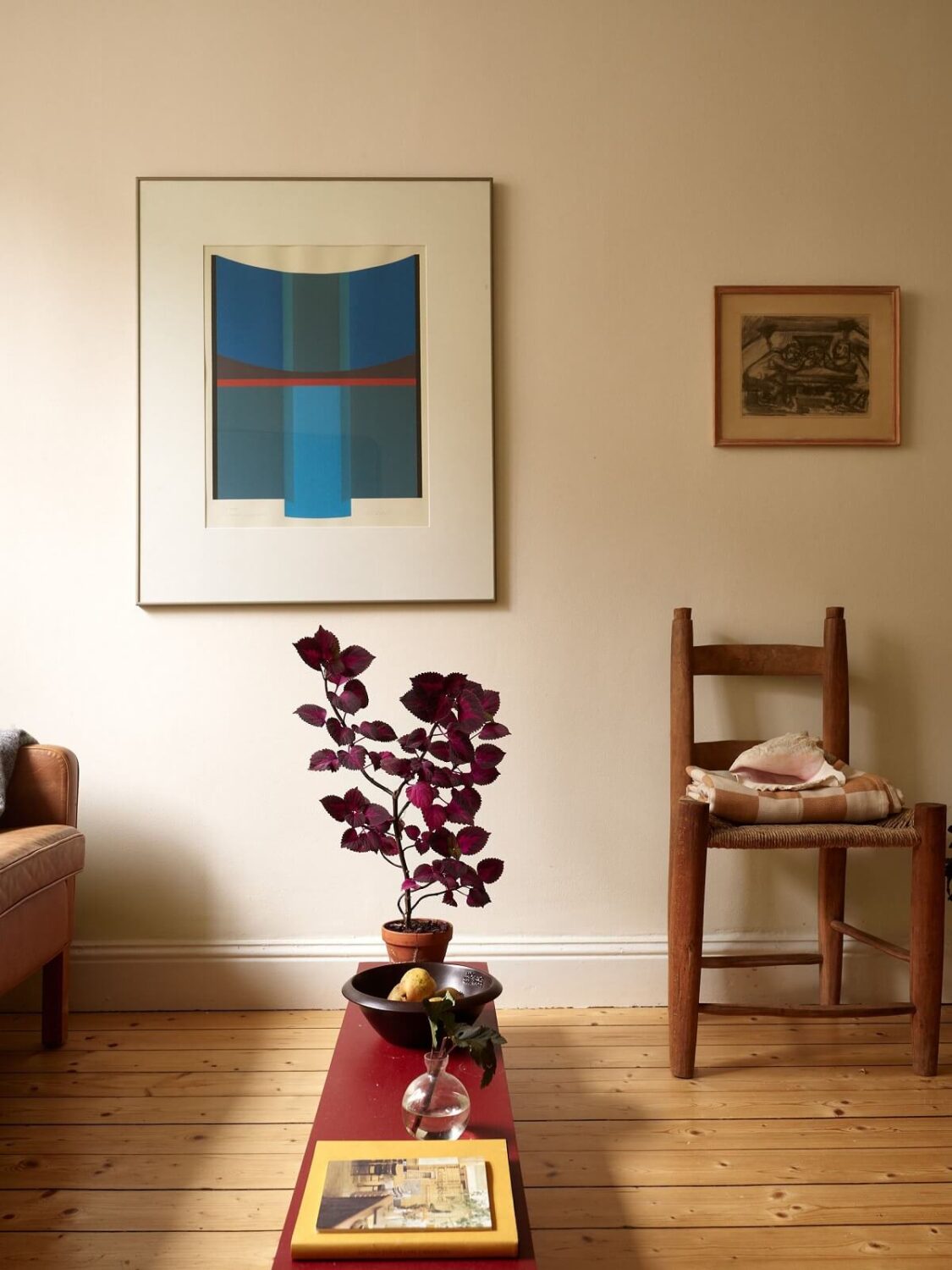 A Cozy Swedish Apartment Filled with Charm 4 living room with red coffee table