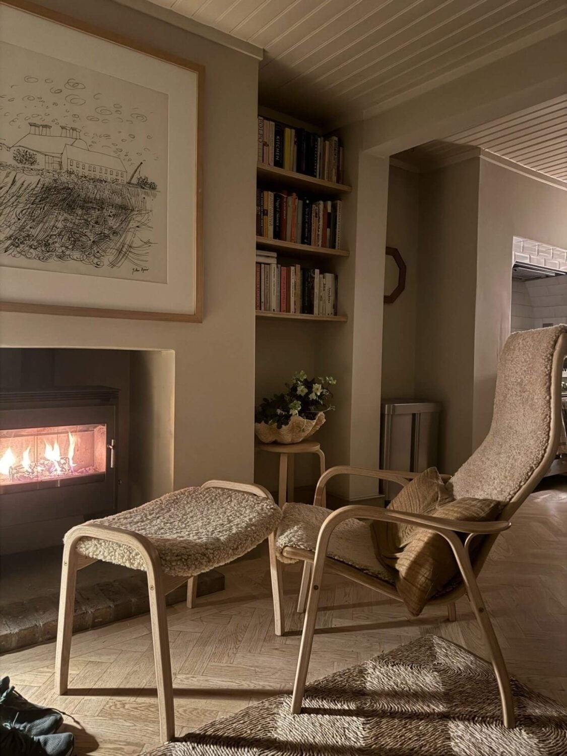A Cozy and Charming Georgian Townhouse in London 11 lounge chair in front of the fireplace
