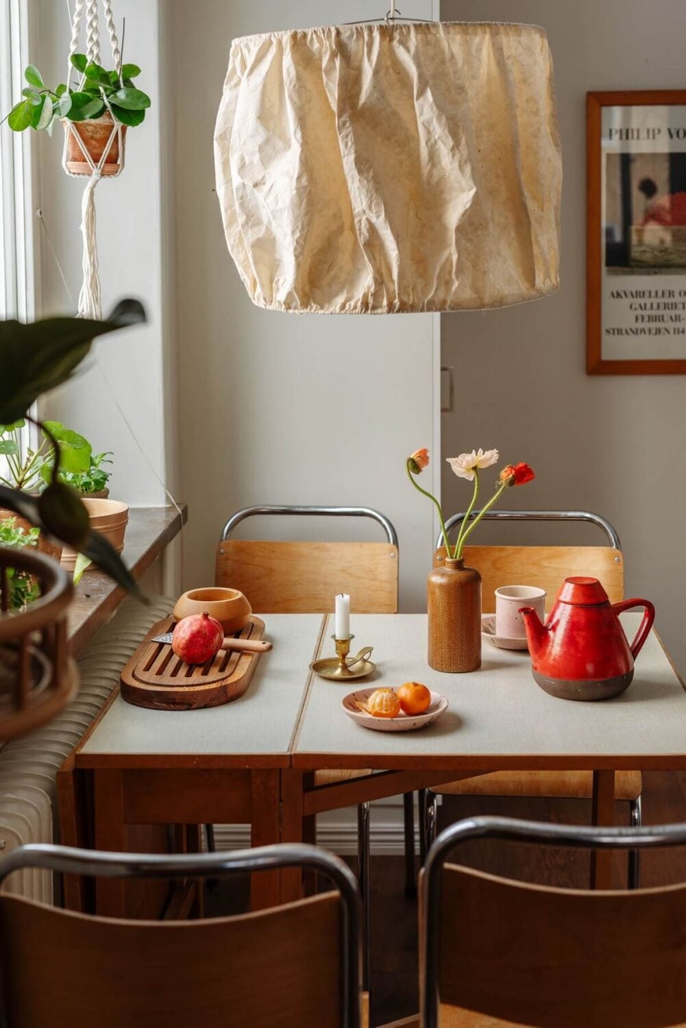 A Small Swedish Apartment with Warm Color Accents 13 midcentury kitchen table