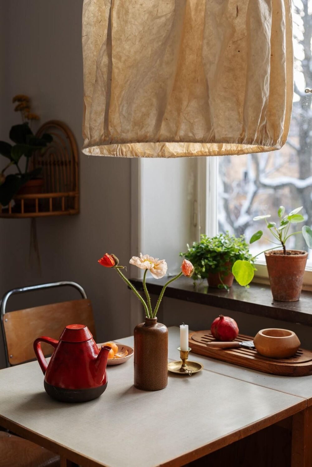 A Small Swedish Apartment with Warm Color Accents 12 midcentury kitchen table detail