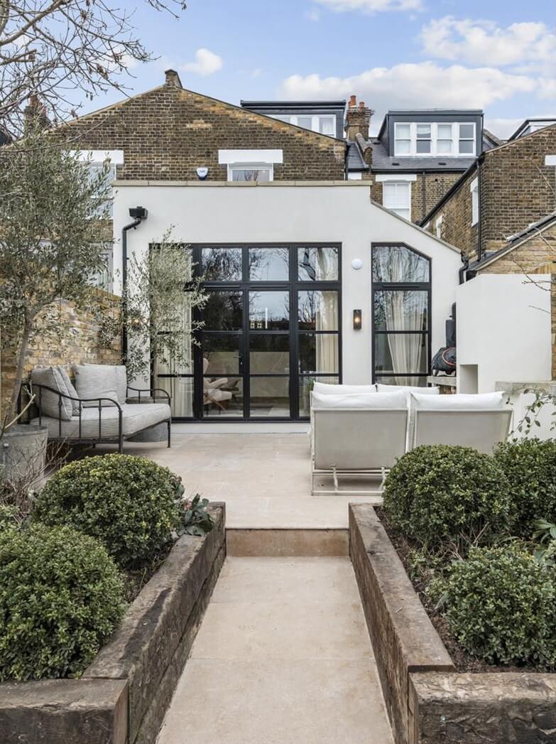 Modern Rustic Interiors in an Edwardian House in London 32 modern garden and extension with crittal windows