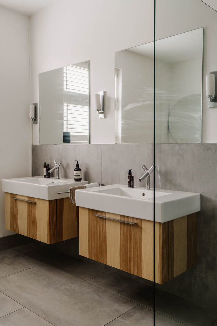 Colorful Walls in an English Victorian Townhouse 15 modern gray bathroom with striped wooden vanity cabinets nordroom