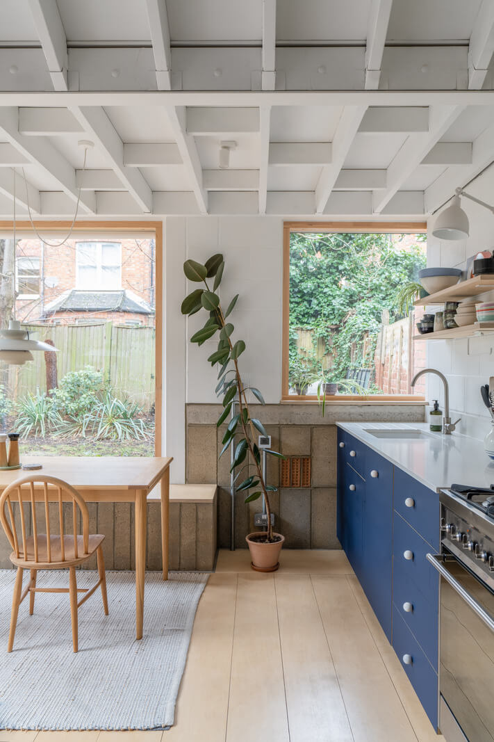 An Award-Winning Apartment with a Modern Extension 7 modern kitchen extension blue cabinets exposed ceiling nordroom