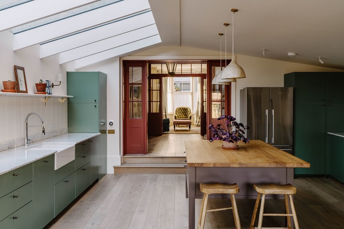 A Restored and Extended London Townhouse 7 modern kitchen extension green cabinets and purple island