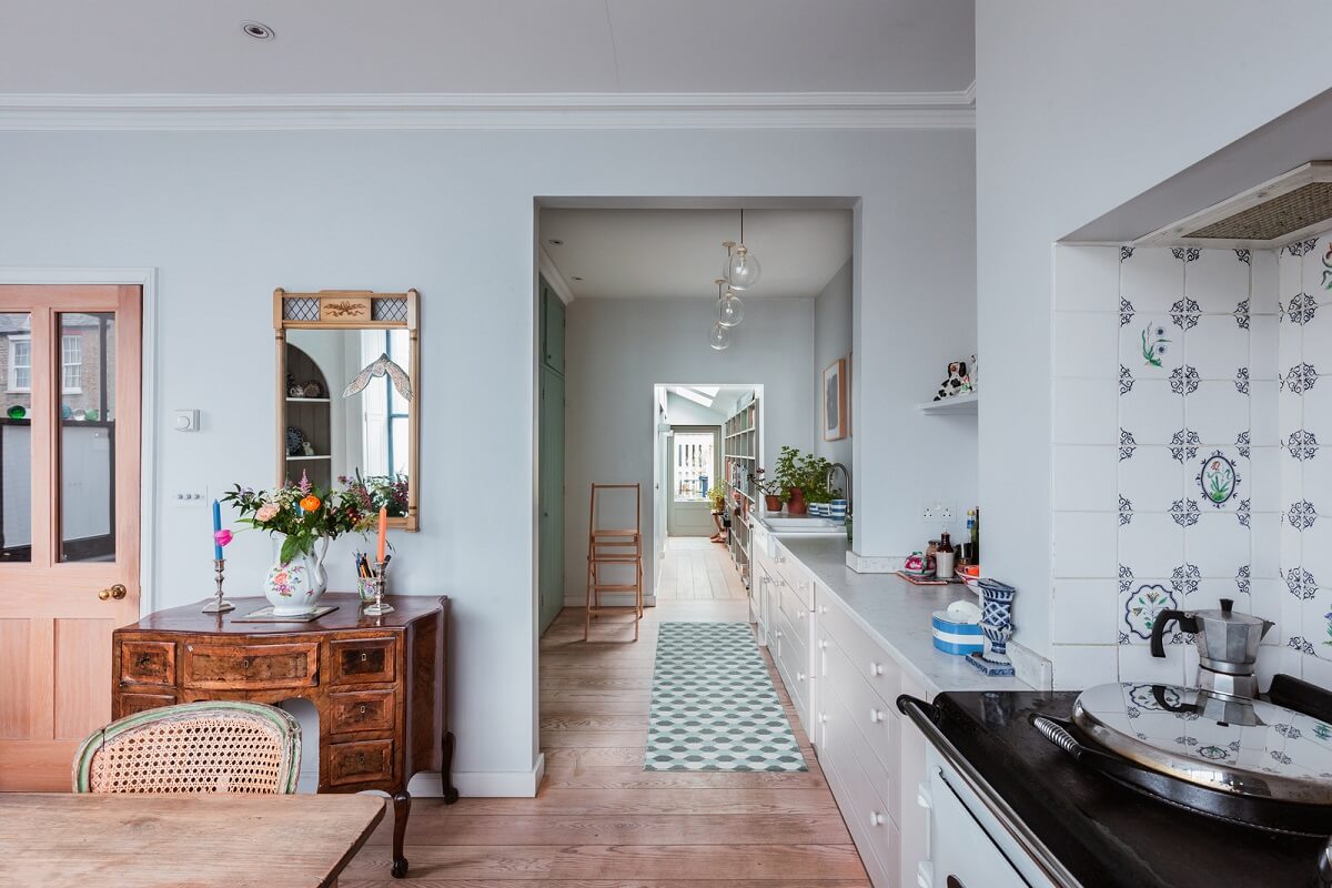 A Home with Cottage Interiors in a Former Cambridge Shop 3 open plan kitchen light blue walls