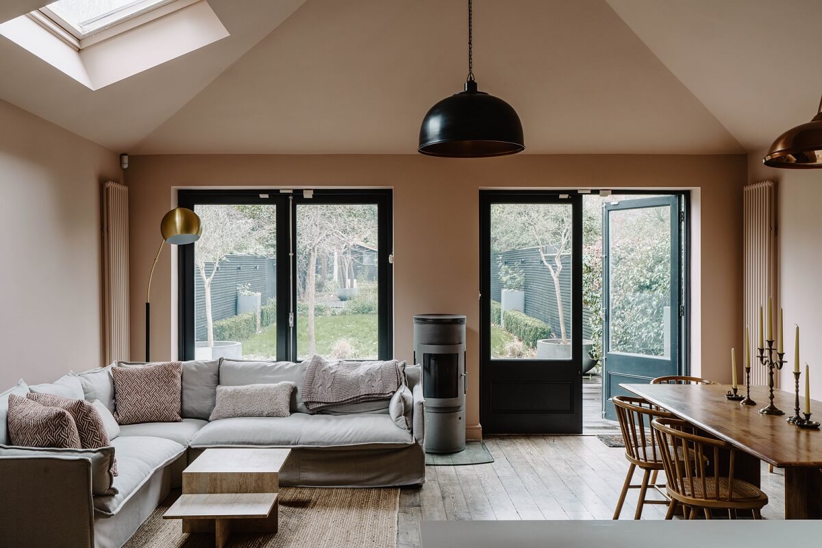 Colorful Walls in an English Victorian Townhouse 9 open plan kitchen living space pitched ceiling pink walls nordroom