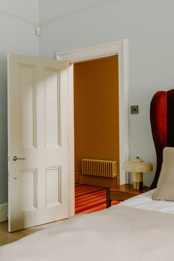 Colorful Walls in an English Victorian Townhouse 14 pink headboard detail
