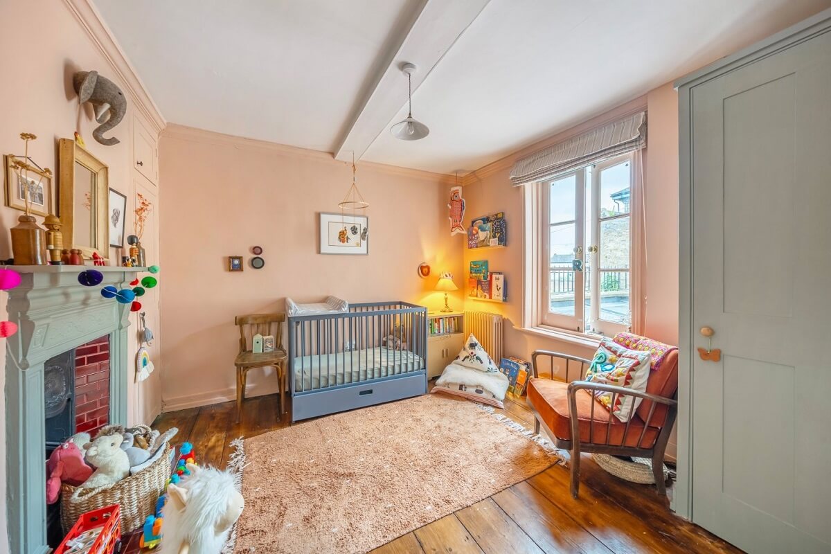 A Colorful Historic Family Home in London 25 pink nursery