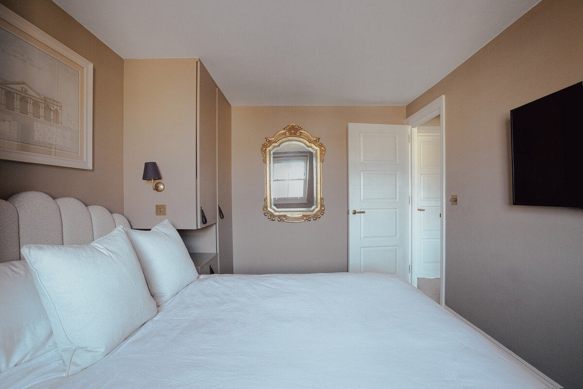 An Exposed Brick Wall in a London Duplex Apartment 15 pink walls bedroom