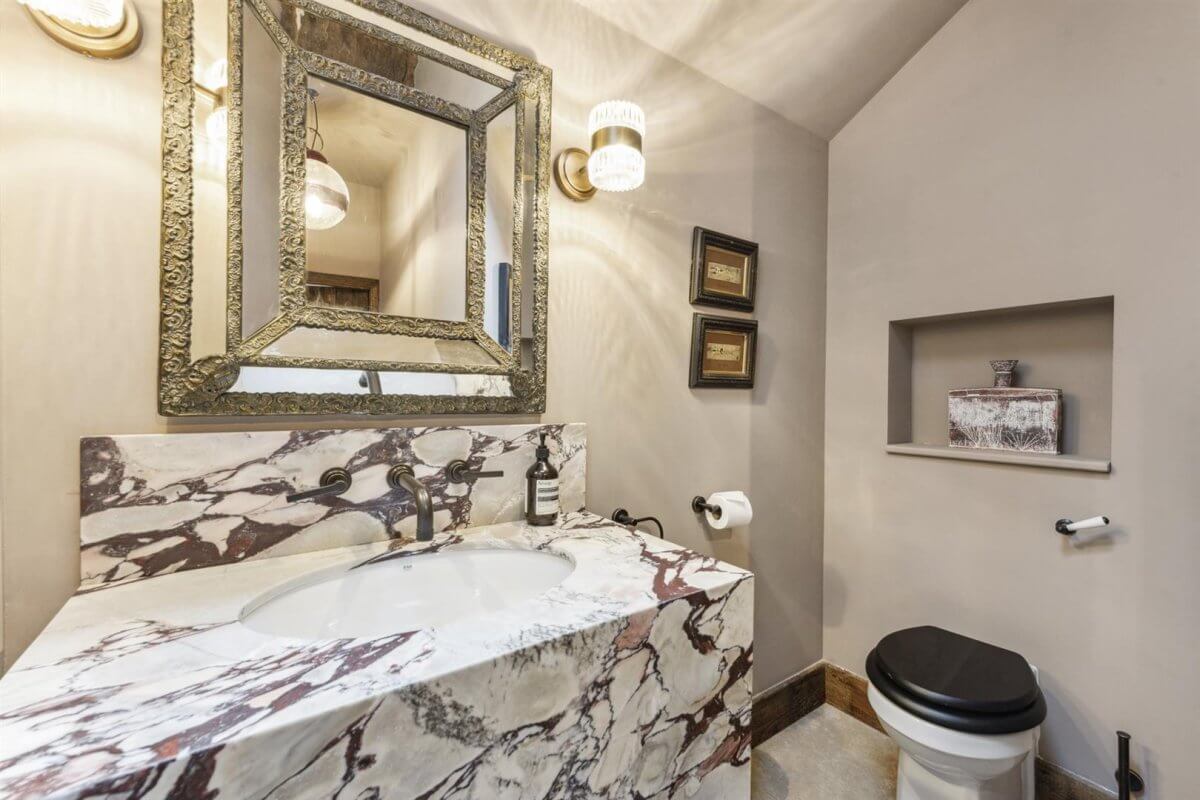 Modern Rustic Interiors in an Edwardian House in London 26 powder room with marble sink