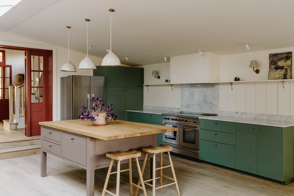 A Restored and Extended London Townhouse 11 purple kitchen island and green cabinets