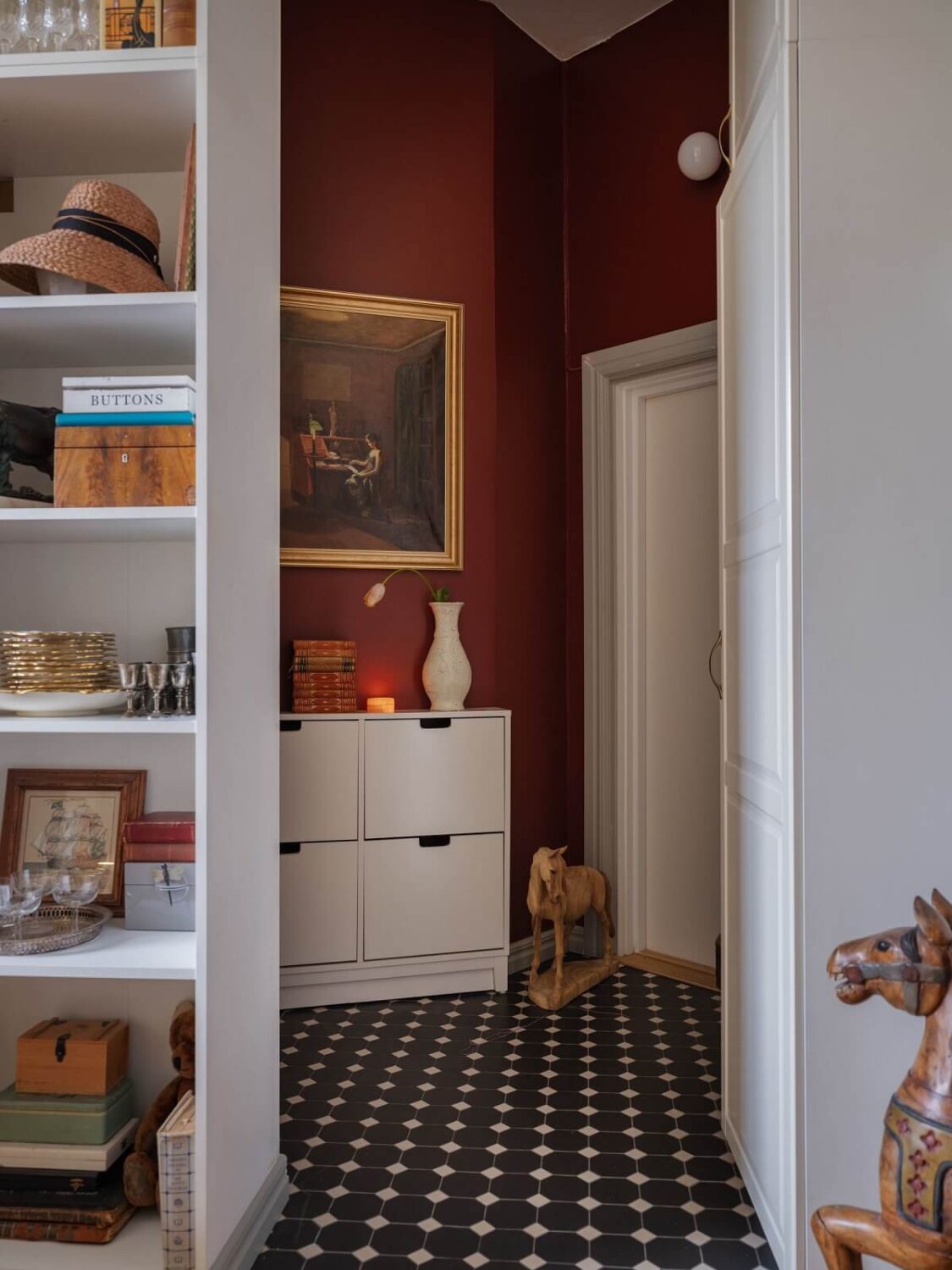 A Tiny Apartment with Antique Furniture 18 red painted hallway with black and white floor nordroom