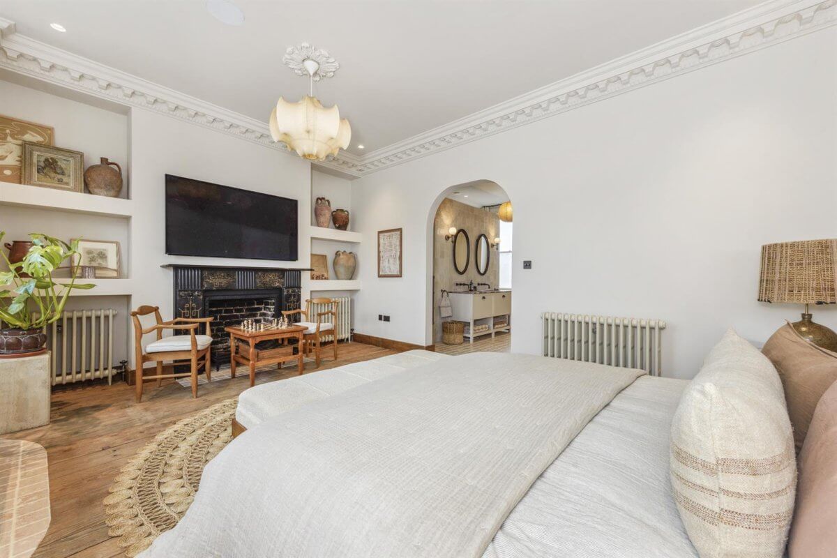 Modern Rustic Interiors in an Edwardian House in London 21 serene bedroom with fireplace