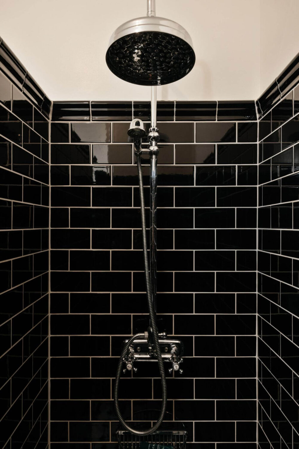 An Industrial Apartment with Black Walls 18 shower with black tiles