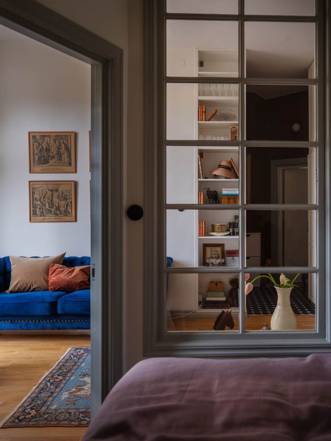 A Tiny Apartment with Antique Furniture 17 small apartment with window between living room and bedroom